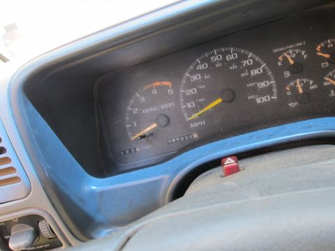 2001 Ford Crown Victoria - Close-up of a vehicle's dashboard, showing the speedometer and tachometer with mileage displayed.