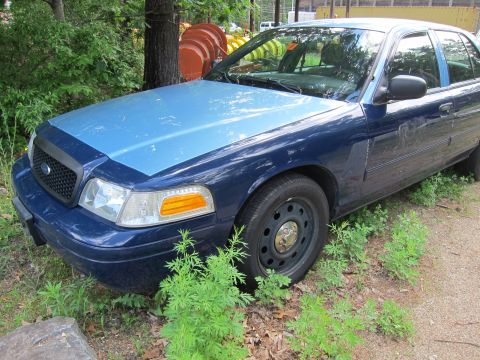 2001 Ford Crown Victoria - This 2001 Ford Crown Victoria sedan is seen from a 3/4 front angle, with a two-tone blue paint scheme.