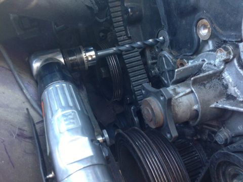 1996 Ford Probe - Drilling into an engine's timing belt pulley system.