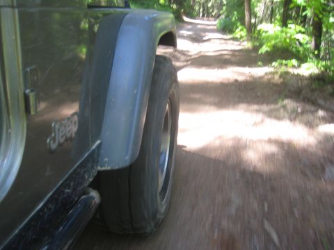 2005 Jeep Wrangler - Driving a 2005 Jeep Wrangler on a wooded dirt road.