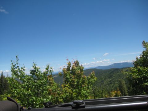 2005 Jeep Wrangler - Mountain scenery viewed from a vehicle on a clear day. The image has a watermark for SUPERMOTORS.NET.