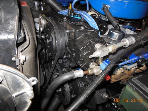 1979 Ford F-150 - Close-up view of an engine compartment, showing various engine parts and hoses.