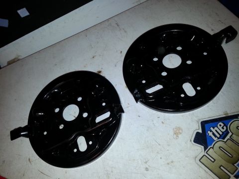 1991 Ford Festiva - Pair of brake dust shields shown on a flat surface.