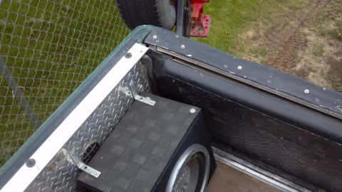 1986 Ford Bronco - Passenger rear corner. You can see where I screwed in snap studs to my tailgate cover, rather than drilling into the sheet metal itself.