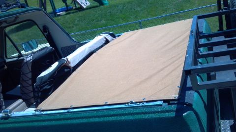 1986 Ford Bronco - Cover snapped into place on the sides, rear, and middle bow. The excess is tucked back and the seat folded out. I used Sunbrella in the 601…