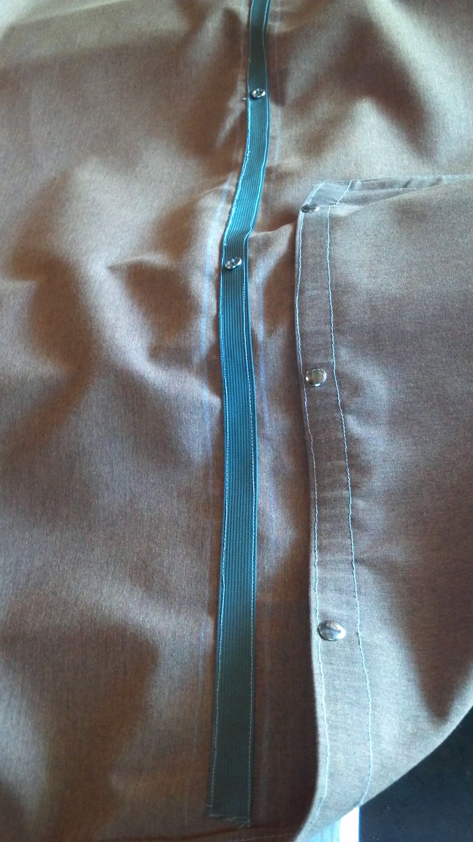 closeup of the seam and the snaps.