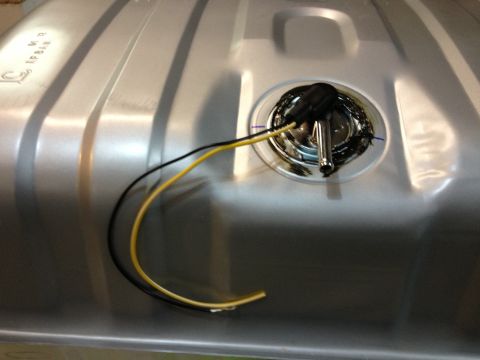 1978 Ford Bronco - Close-up of a fuel tank sending unit with electrical connectors and wires.