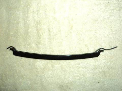 2004 Mercury Grand Marquis - A black trim piece, likely for a vehicle's grille, is shown against a textured background.