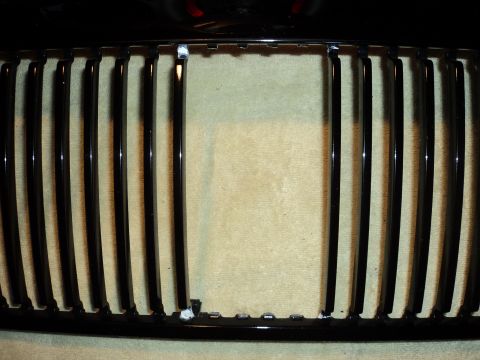 2004 Mercury Grand Marquis - Close-up of a black vertical bar grille, likely a replacement part.
