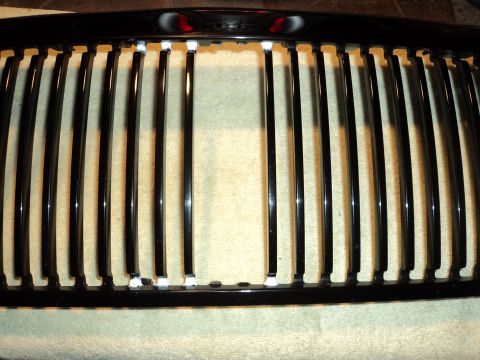2004 Mercury Grand Marquis - Close-up of a black grille with vertical bars, likely a replacement part.