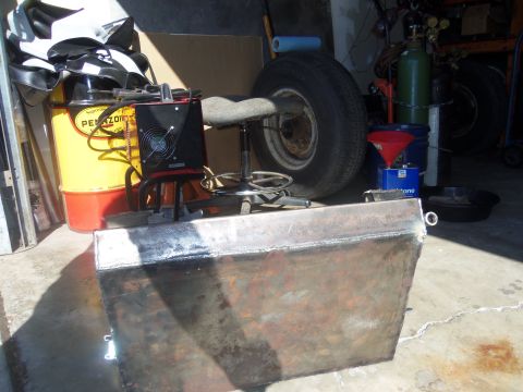 1968 Ford Bronco - A collection of tools and unfinished metal projects are stored in a garage setting.