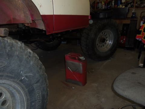 1968 Ford Bronco - Vehicle part and a red jerry can are visible in a garage setting.