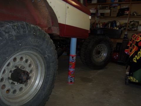 1968 Ford Bronco - This Ford Bronco is being supported by cans of spray paint while undergoing work in a garage.