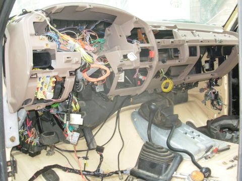 1983 Ford Bronco - After a false start last night (the inside A/C box was slightly too high), it's IN!!! I've started fishing the wires through to where they…