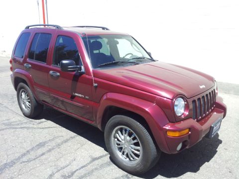 2005 Chevrolet Venture - This is a red Jeep Liberty SUV, model year 2005.