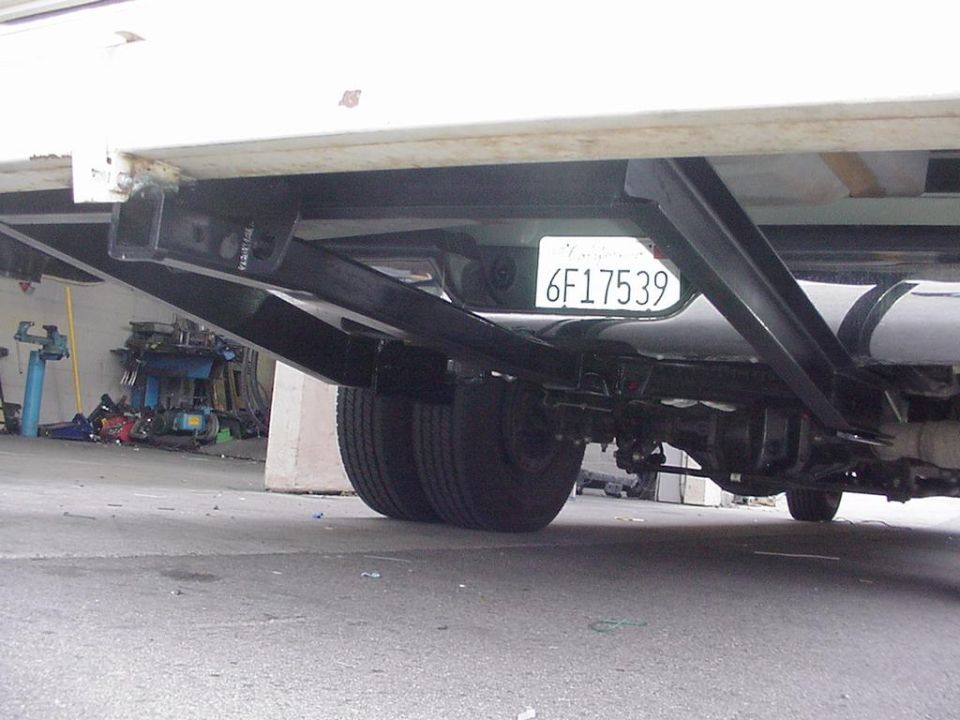 Trailer hitch extension with dual rear wheels and California license plate 6F17539