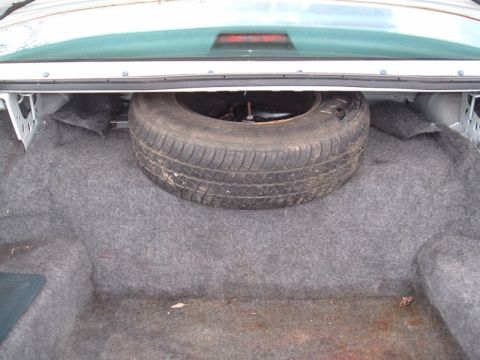 1991 Ford LTD Crown Victoria - Spare tire in the trunk of a 1991 Ford Crown Victoria LTD.