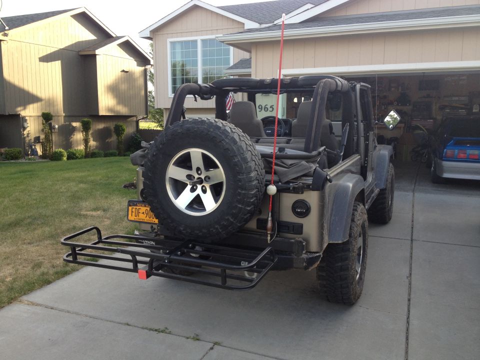 2005 Jeep Wrangler rear view with hitch hauler and spare tire