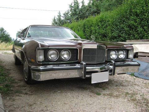 1991 Ford LTD Crown Victoria - Front view of a 1975 Mercury Grand Marquis parked outdoors.