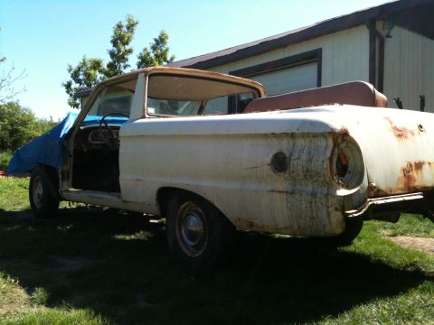 1963 Ford Ranchero - This 1963 Ford Ranchero is seen in a three-quarter front view, appearing to be in a state of disrepair.