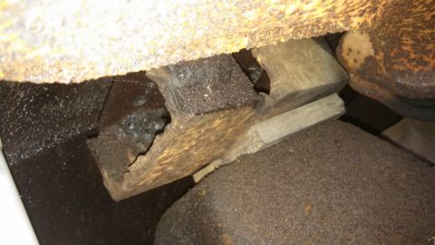 1979 Ford Bronco - This image shows a close-up view of a damaged rubber mount and metal bracket, possibly from a vehicle's undercarriage.