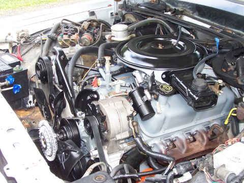 1991 Ford LTD Crown Victoria - Engine bay of a 1991 Ford Crown Victoria LTD, showing the V8 engine with various components and wiring.
