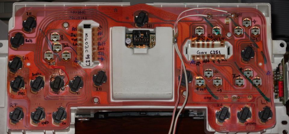 This cluster required far fewer mods than the previous one, and it turns out that red wire I soldered on is useless - that location is blacked out on the tach face, and the SFT position below on the other side is labelled FUEL RESET on the bezel.  So swapping the wire in the connector will be an easy fix.  The Wh/R wire is my standard oil gauge mod, and of course I installed a low fuel light.  I'll probably put the cruise indicators in the shift blockoff panel (when I find one).