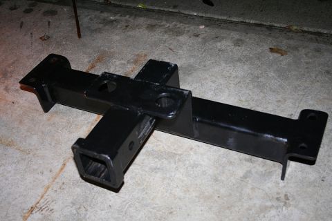 1999 Ford Ranger - A black trailer hitch receiver is shown on a concrete surface.