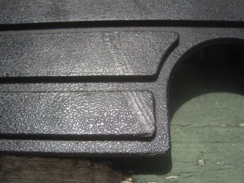 1993 Ford Bronco - This is a close-up shot of a textured plastic automotive part.