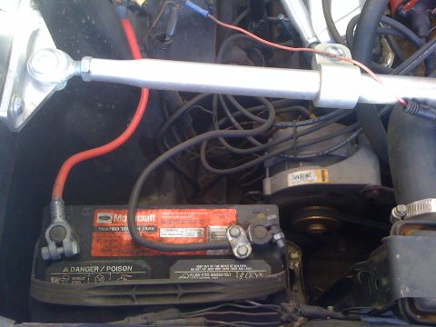 1964 Ford Ranchero - Close-up view of the engine bay, showing the battery and various engine components.