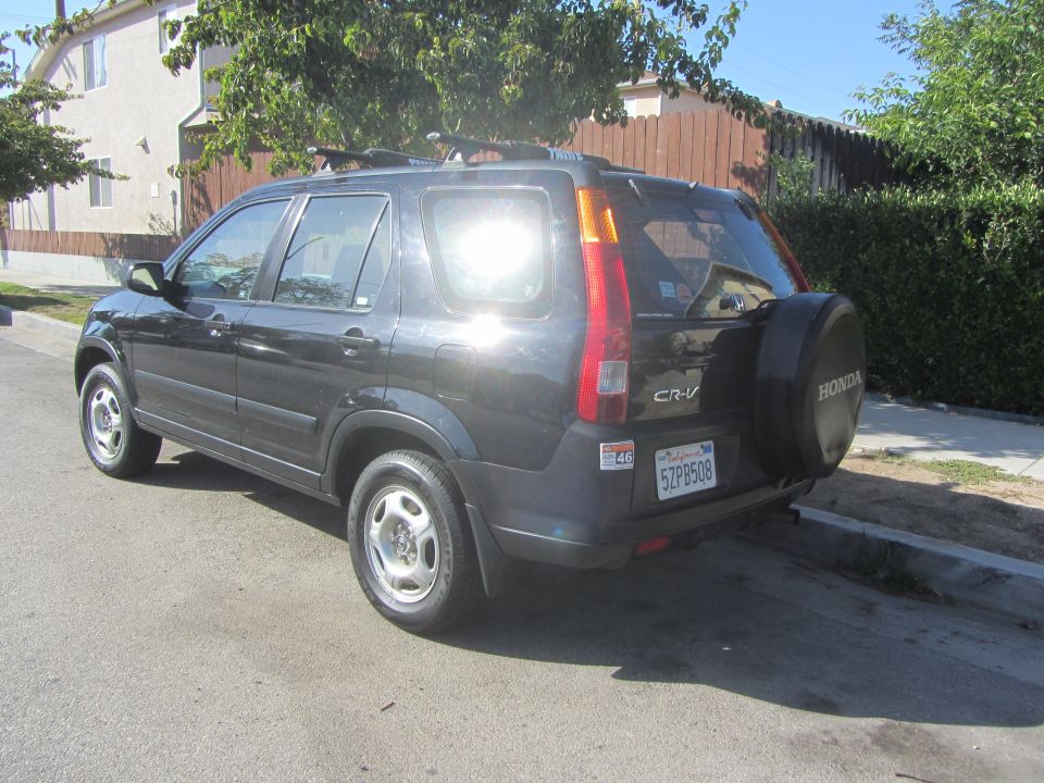 Black 2003 Honda CR-V rear view with spare tire on back