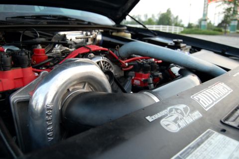 1985 Mercury Grand Marquis - Customized engine bay a prominent Vortech supercharger and aftermarket ignition system.