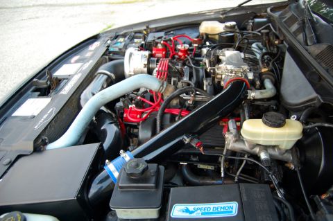 1985 Mercury Grand Marquis - Engine bay details, showing aftermarket modifications and various engine components.