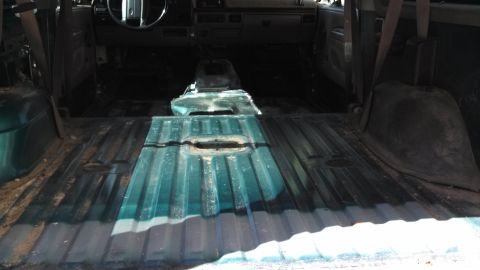 1996 Ford Bronco - Interior view of a 1996 Ford Bronco with rear seating and flooring removed for customization.