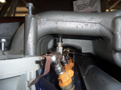 1968 Ford Bronco - Close-up view of an engine's intake manifold and fuel injection system.