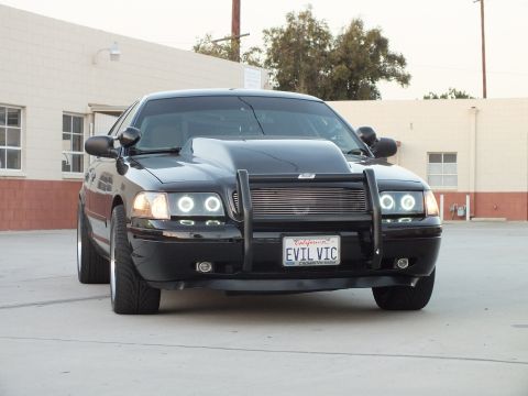 2003 Ford Crown Victoria - black Ford Crown Victoria front with billet grille, push guard, halo headlights and California plate EVIL VIC.