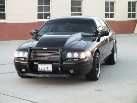 2003 Ford Crown Victoria - black Ford Crown Victoria photographed front quarter with billet grille, halo headlights and California plate EVIL VIC.