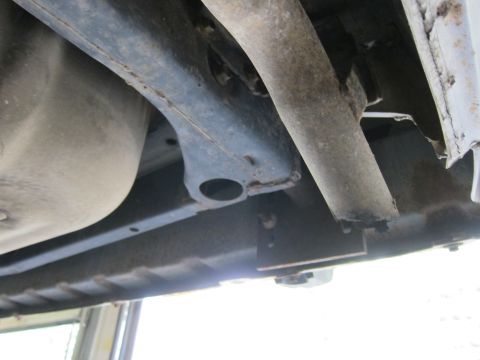 1991 Ford LTD Crown Victoria - Close-up view of the undercarriage, showing suspension parts and a fuel tank, with no visible year identification.