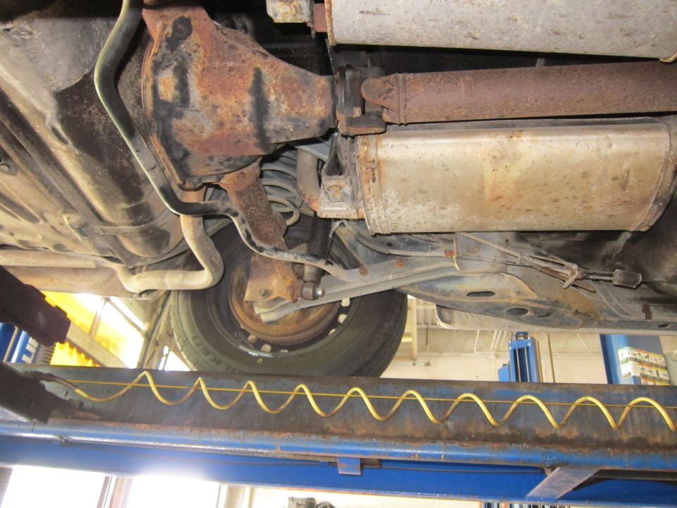 Undercarriage view of a vehicle's rear axle and exhaust system