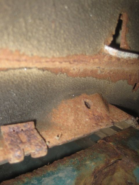 1993 Ford Bronco - Close-up view of heavily rusted metal components, with a Supermotors.net logo visible in the lower right corner.