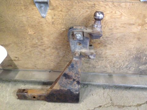 2000 Ford E350 - Trailer hitch receiver with ball mount, showing significant rust.