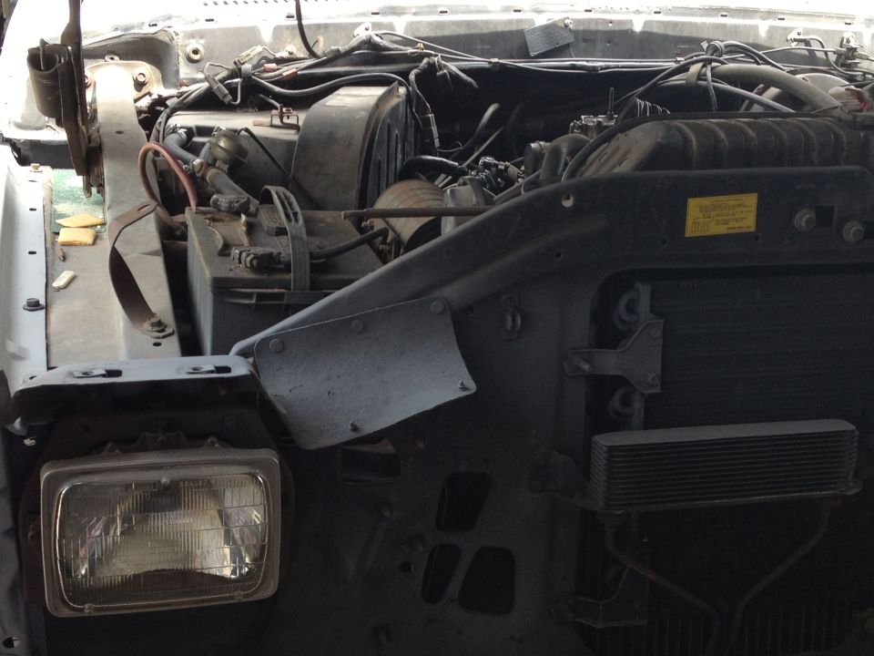 Engine bay and headlight of a disassembled truck