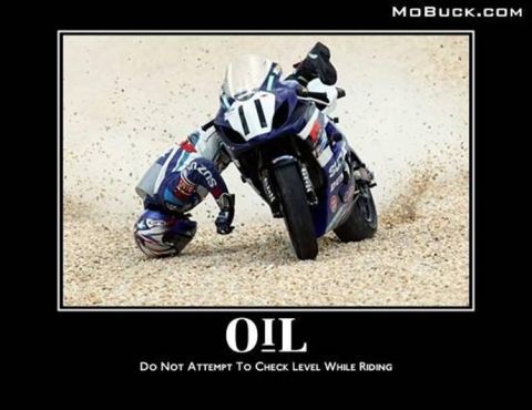1996 Ford F-150 - A motorcycle rider tumbles on a sandy surface, with their helmet coming off during the fall.