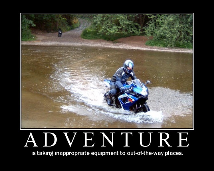 Blue sport motorcycle riding through water, another motorcycle in background