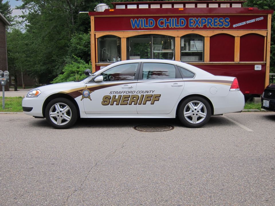 White Strafford County Sheriff Chevrolet Impala sedan, side view