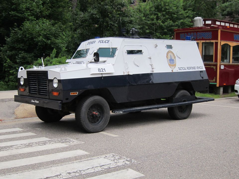 Dover Police white and navy armored Tactical Response Vehicle at crosswalk