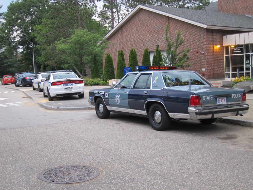Blue State Police Ford LTD Crown Victoria sedan, rear three-quarter view