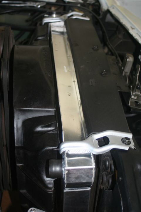 1976 Ford Ranchero - Close-up view of a vehicle's radiator and engine bay components, with visible website text.