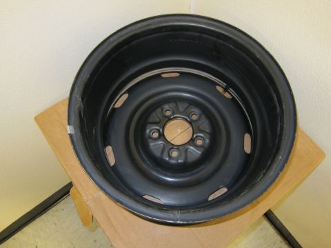 2001 Ford Crown Victoria - A black steel wheel rim is shown, likely a spare tire rim, with five visible lug nut holes.