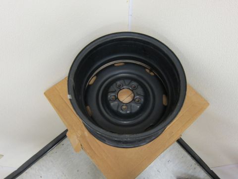 2001 Ford Crown Victoria - A single black steel wheel rim is shown, likely a spare tire rim.